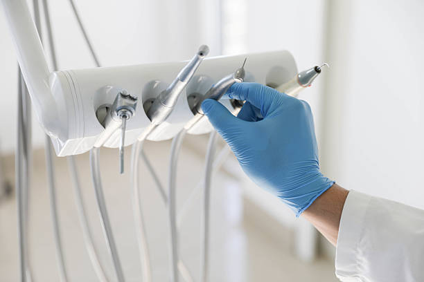 Professional Tooth Extraction technician working in Muskegon, MI